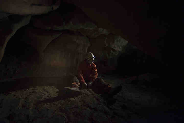 Andrew Hall, first year graduate student at Ohio University, takes a break from crawling through the narrow spaces inside of Rapps Cave at the West Virginia Association for Cave Studies in Frankford, West Virginia.     (Alexandria Skowronski / Ohio University)